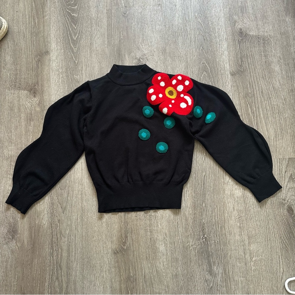 Black Sweater with Red Floral Accent